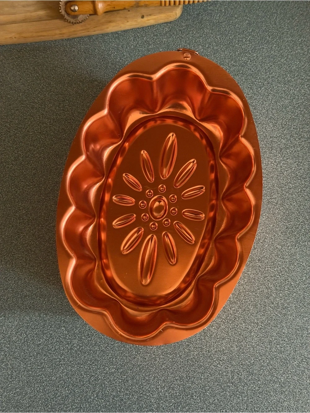 Vintage copper-colored aluminum daisy pattern mold